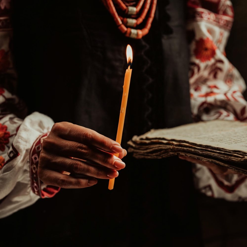 Ukrainian woman reading ancient book - Bible. Concentrated follows finger on paper page under candle light. History of Kyiv Rus. Psalter, 19th century, prayers and psalms. SSUCv3H4sIAAAAAAAAA01Py26DMBD8lz2DhHmEhq/oLYeoB4M3ZBVjI3tpVCH/e20CbXya2fHszK5ACjpQomxVjUWuRFPnQqDKZXlrE/q4YVU2jawgAyUZoRNVVdZncSrO9alsi/gy6KWnAboVSOvFs5NM1kAXFYdGodsgKmLrSOrIQgaeJS8efbRFNsTdY1Q3fuy7rmkeC8Zwv/QJhOyYfaKdNf4pFzuheZPfLF8ZyBHN8JOiQuqkUW7J1yg9noxu2mtYvqe2Cc6OBjLjXi9eZacXNpaTd0tgOzxI7ebXRXeKU5eyYJm1lQrVLi/9RMwHdfhN+Pz/HUL4Bddeh8qPAQAA